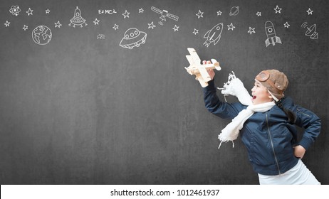 Kid playing in pilot costume has fun with imagination dream flying plane for learning inspiration world in innovative science technology engineering maths STEM education and children's day concept