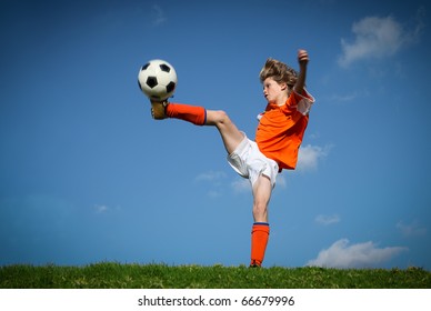 Kid Playing Soccer Kicking Football