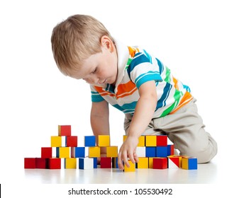 kid playing toy blocks  isolated on white background
