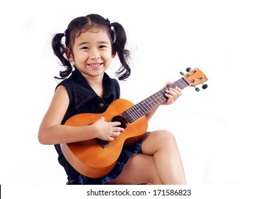 Kid Playing Ukulele