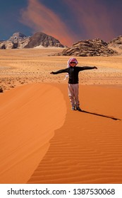 A Kid Plays In Wadi Rum Desert, Jordan 