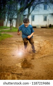 Kid In Puddle, Splashing In Puddle