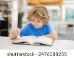 Kid reading book. Child reading book in a public library.