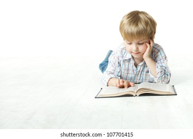 Kid Reading Book, Little Child Boy Read In School, Lying Down On Floor Over White Background