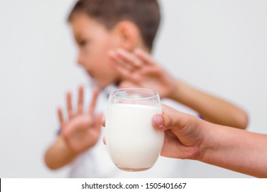 Kid Refusing To Drink Milk. Lactose Intolerance. Dairy Intolerant Child Refuses To Drink Milk