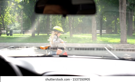 Kid Riding Bicycle In Street, Attentive Driver Stopping Car, Accident Prevention