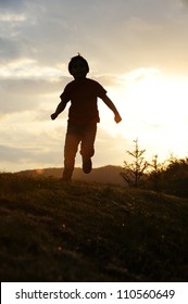 Kid Running On Meadow