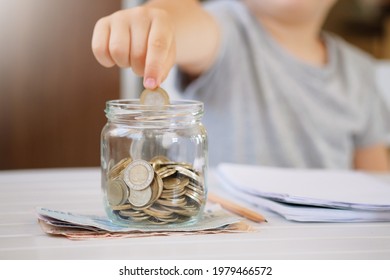 Kid Save Money And Account Banking For Finance Concept. Turkish Lira Coins In Glass Jar And Banknotes.