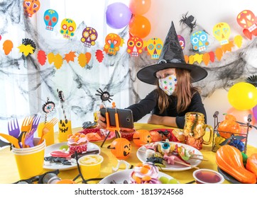 Kid Say Cheers. Dressed In Spooky Halloween Costumes Girl Headwear Having Video Chat On Laptop With Friends In Decorated Home. Traditional Autumn Holiday