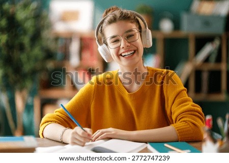Kid at school. Child is learning in the class or doing homework.