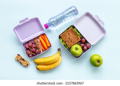 Kid school lunch box set of fruits and vegetables, top view - Shutterstock ID 2157863967