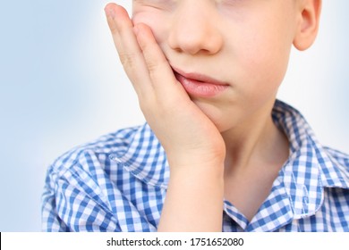 Kid, A Schoolboy Holds His Hand On The Lower Jaw, Wrinkles From Toothache, The Concept Of Pediatric Dentistry, Treatment Of Milk Teeth, Oral Care