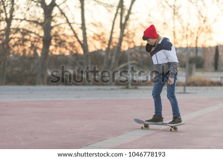 Similar – teenager practicing with skateboard at sunrise city