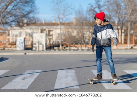 Similar – teenager practicing with skateboard at sunrise city