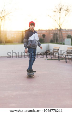 Similar – teenager practicing with skateboard at sunrise city