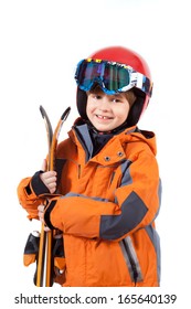 The Kid In The Ski Clothing With Skis 