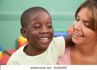Kid smiling with her teacher