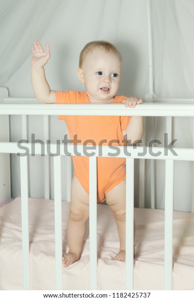 Kid Standing Baby Crib Looking Praying Royalty Free Stock Image