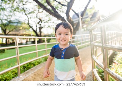 Kid Toddler Boy Run Walk.Cute Mixed Race Boy Running Across The Road And Home And Smiling.Toddler Kid Boy Child Run For Fit And Good Heath.Sport Activity For Kid.kindergarten Kid Strong Muscle.outdoor