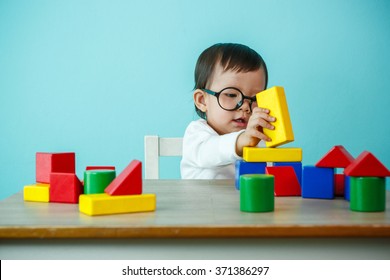 kid toddler playing wooden toys at home or nursery, Baby healthy and preschool concept