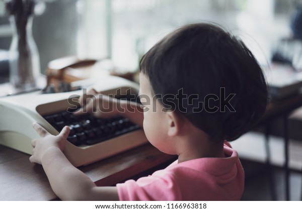 Kid Typing On Typewriter Coffee Cafe Stock Photo Edit Now 1166963818