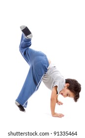 A kid upside down smiling to the camera, looking like a circus artist or maybe a capoeira fighter which is a native Brazilian fight style. Isolated on white.