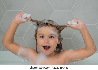 Kid Washing Hair. Boy Child In A Bath With Foam. Kids Bathing And Hygiene Procedures. Bath Tub With Soap Bubble. Funny Kids Face.