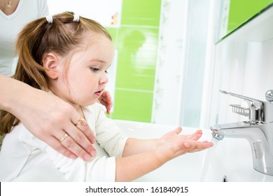 Kid Washing Hands With Adult