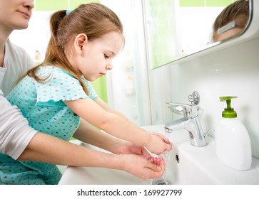 Kid Washing Hands With Mom