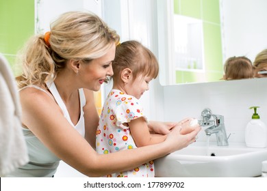 Kid Washing Hands With Mom