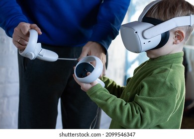 Kid Watching A Movie Or A Quest App On A Modern Virtual Reality VR Headset. Metaverse.