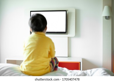 Kid Watching Tv In The Bedroom