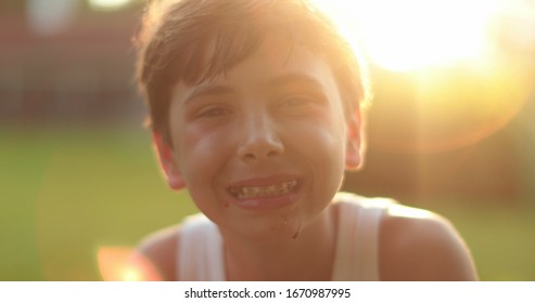 
Kid Wearing Braces Smiling Outside With Lens-flare Portrait