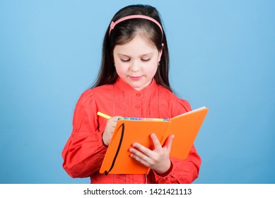 Kid Writing Book. Book Concept. Development And Education. Homework Exercise. Write Composition. Literature Club. Personal Diary. Study And Learn. Poetry Author. Girl Hold Book Blue Background.