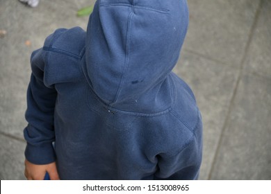 Kid With Wrong Way Round Pullover  Covering His Face With Hood.  