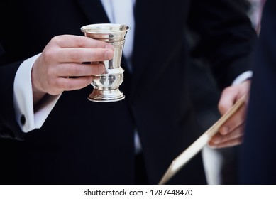 KIDDUSH glass in hand at a Jewish wedding
