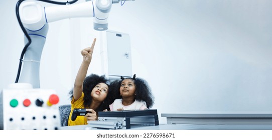 Kid-friendly experiments to education learning technology science robotics mechanics classes intelligent smart,Robotic Arm with remote control while testing his engineering wonder, Copy space for text