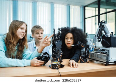 Kid-friendly experiments to education learning technology science robotics mechanics classes intelligent smart, Robotic Arm with remote control while testing his engineering wonder.
