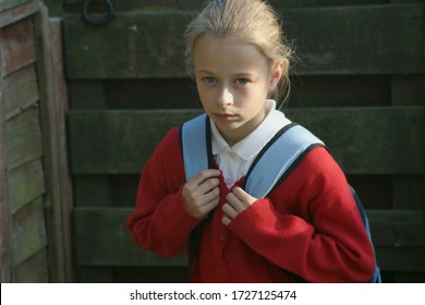 Kidlington, Oxfordshire, UK 09 22 2005 A Girl With A School Uniform And Her School Bag