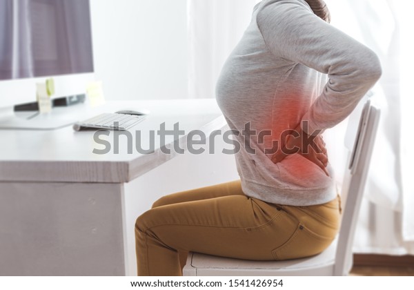 Kidney
pain. Sick back in a woman from sedentary work.
