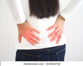 kidney stones or nephrolithiasis and spinal disc herniation,including pancreatic cancer in woman and she touching on her lower back and symptoms of pain and suffering use for health care concept.