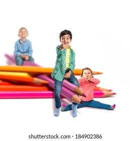 Kids Around Crayons Isolated Over White Background