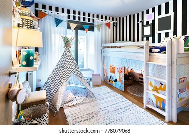 Kids Bedroom  With Bunk Wooden Bed, Teepee, Stands, Carpet Frames And Toys.