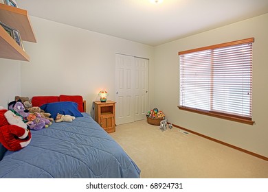 Kids Bedroom With Toys On The Bed