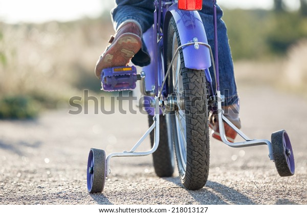 Kids bike with training\
wheels closeup
