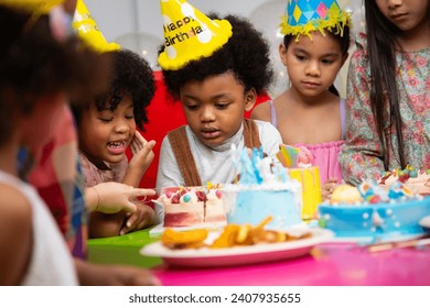 Kids birthday party. Group of diverse kids having fun at birthday party - Powered by Shutterstock
