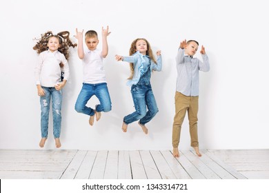 Kids Boys And Girls Merry Happy Beautiful On White Wall Background