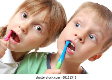 Kids Brushing Their Teeth Over White Background