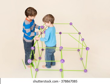 Kids, Children Building A Fort And Sharing Construction Pieces
