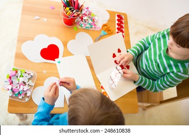 Kids, Children, Doing Valentine's Day Arts And Crafts With Hearts, Pencils, Paper